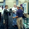 Exhibitors and attendees make connections in the exhibit hall.